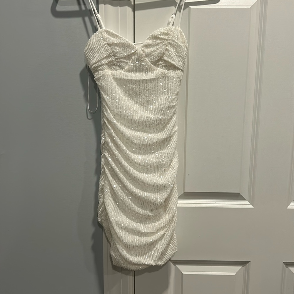 Hello Molly, white mini dress with sparkles!